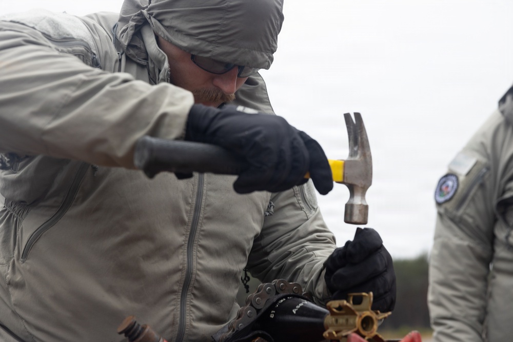 U.S. Marine explosive ordnance disposal technicians execute an experimental demolition range