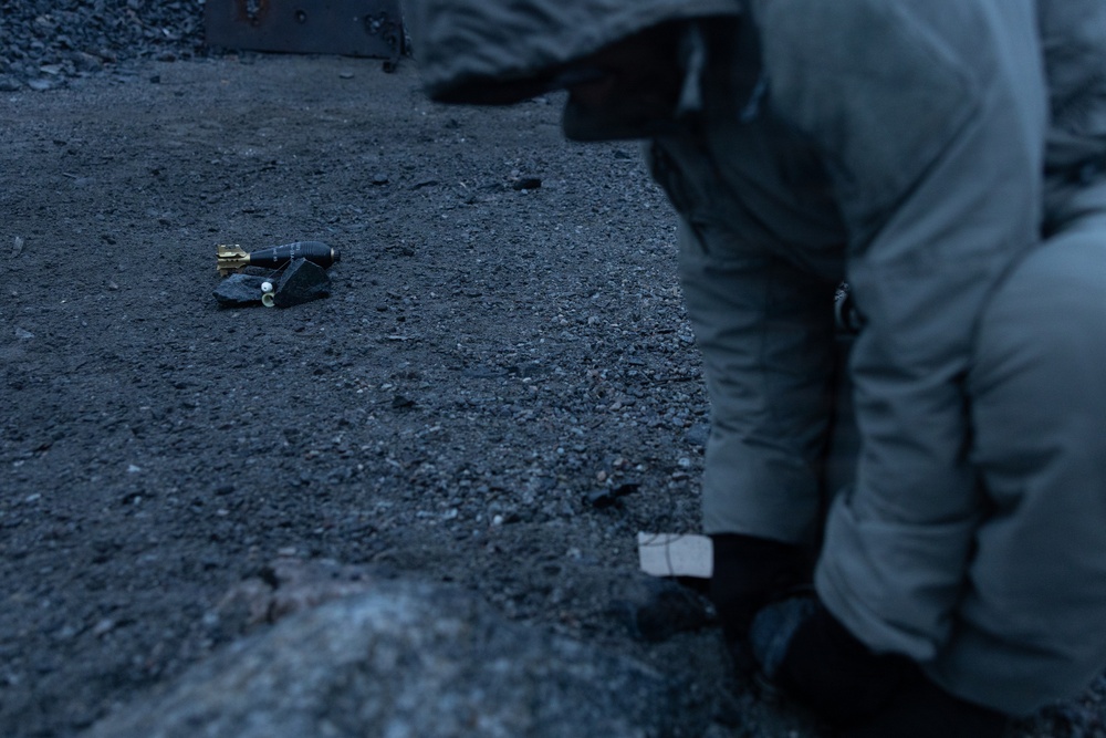 U.S. Marine explosive ordnance disposal technicians execute an experimental demolition range