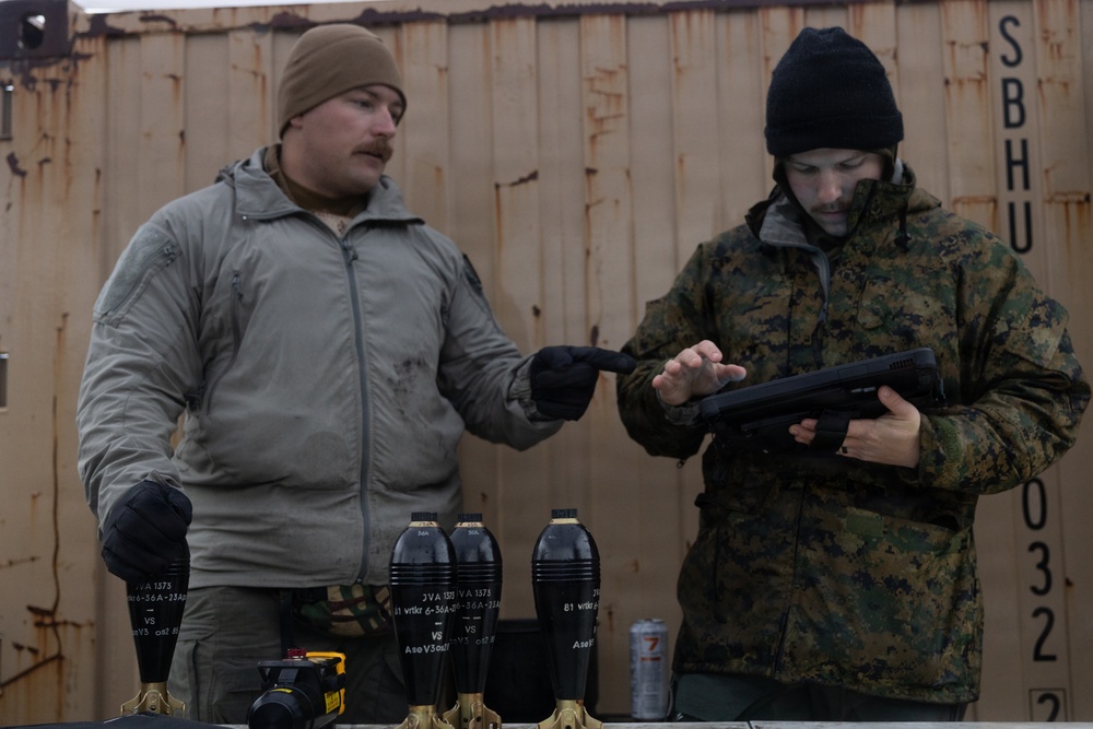 U.S. Marine explosive ordnance disposal technicians execute an experimental demolition range