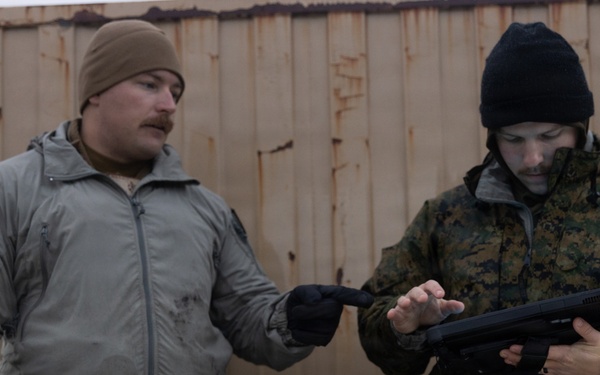 U.S. Marine explosive ordnance disposal technicians execute an experimental demolition range