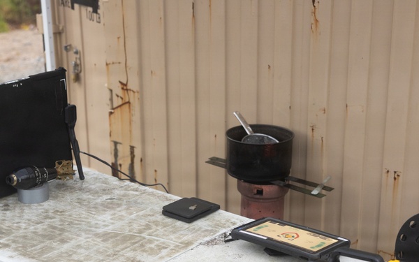 U.S. Marine explosive ordnance disposal technicians execute an experimental demolition range