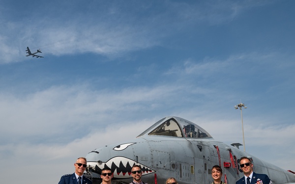 AFCENT commander stands with group in front of A-10, B-52