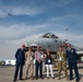 AFCENT commander stands with group in front of A-10, B-52