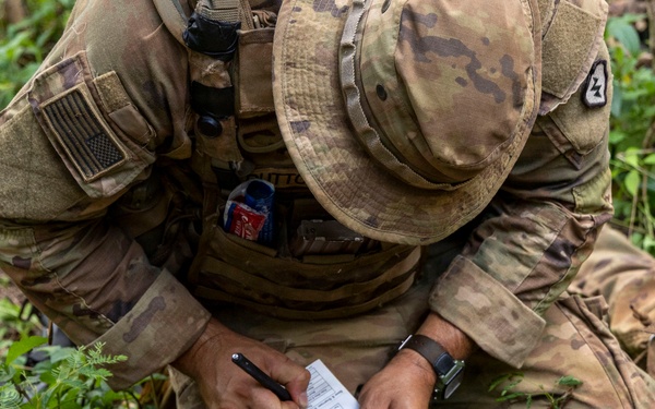 Soldiers Assess Casualties Under Fire
