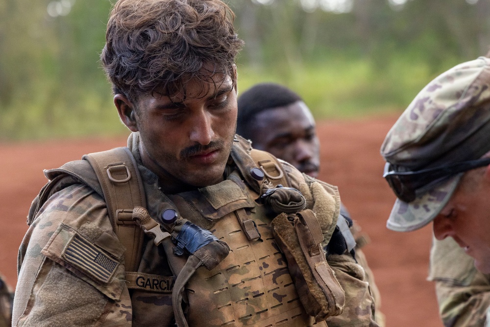 Soldiers Assess Casualties Under Fire