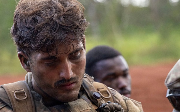 Soldiers Assess Casualties Under Fire