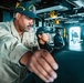 U.S. Navy Sailor Navigates on the Bridge