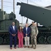 Ceremony Leaders Stand with Upgraded M270A2 at Red River
