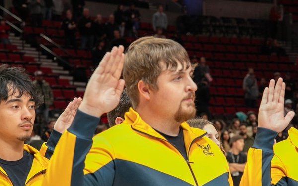 Future Sailors take part in oath of enlistment at NBA game