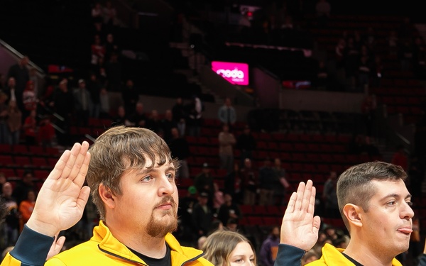 Future Sailors take part in oath of enlistment at NBA game