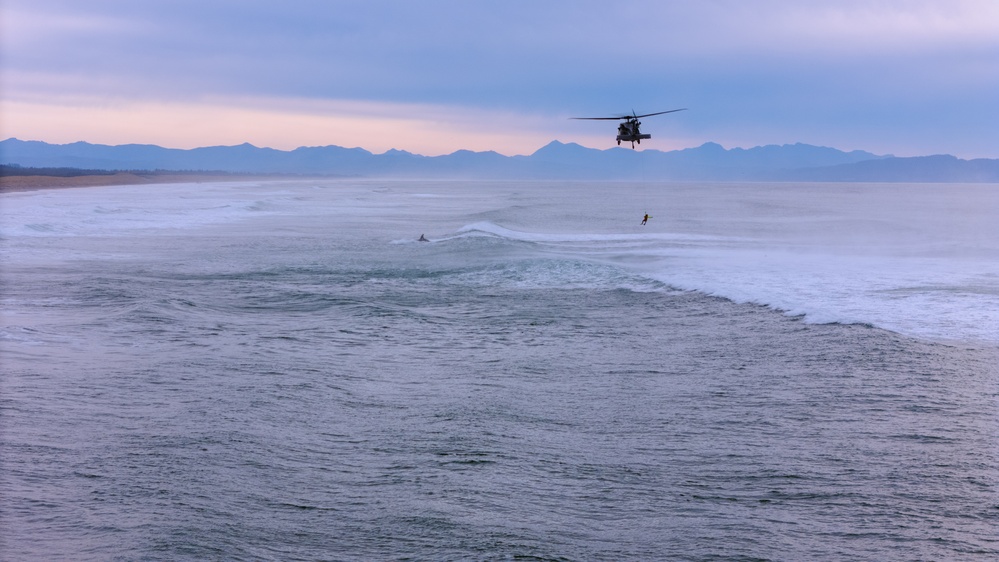Coast Guard Aircrews Train in Surf with Air Force PJs at Fort Stevens