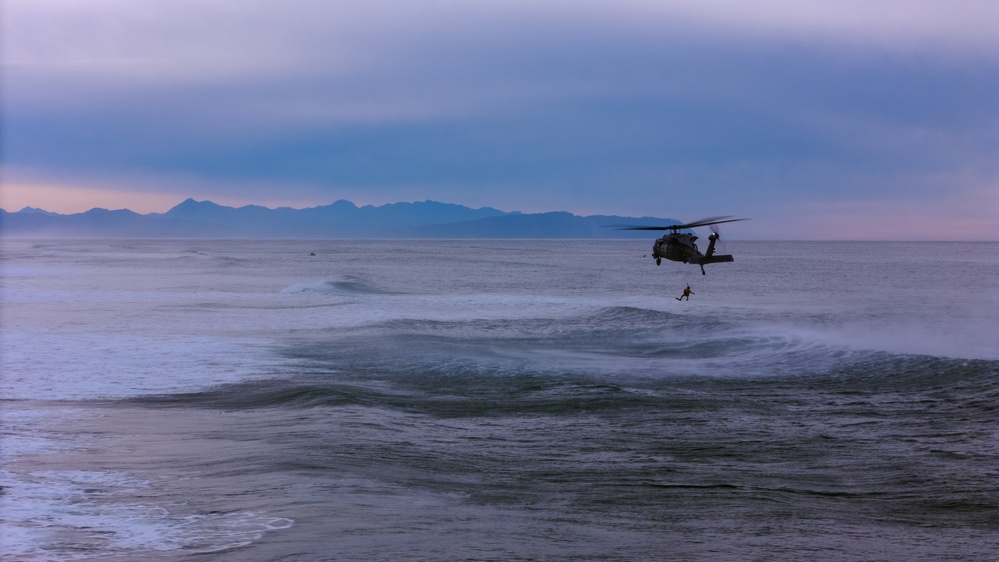 Coast Guard Aircrews Train in Surf with Air Force PJs at Fort Stevens