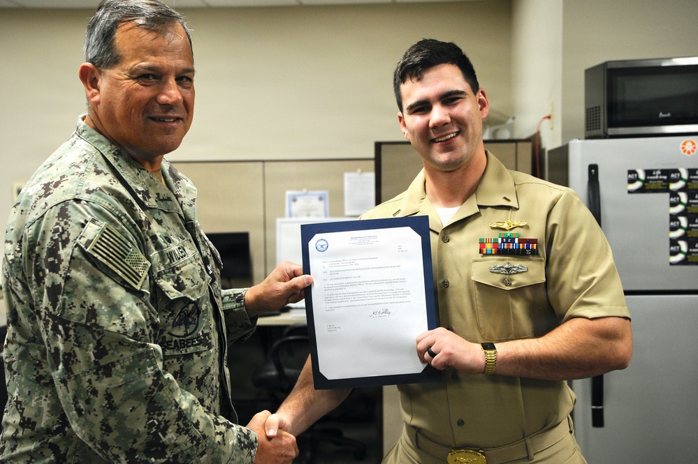 Ensign Graves Earns Information Warfare Officer Designation