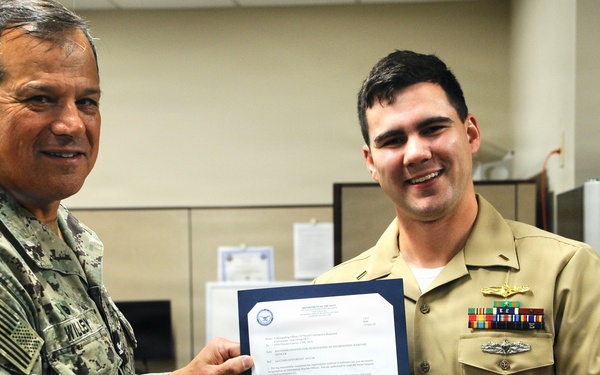 Ensign Graves Earns Information Warfare Officer Designation