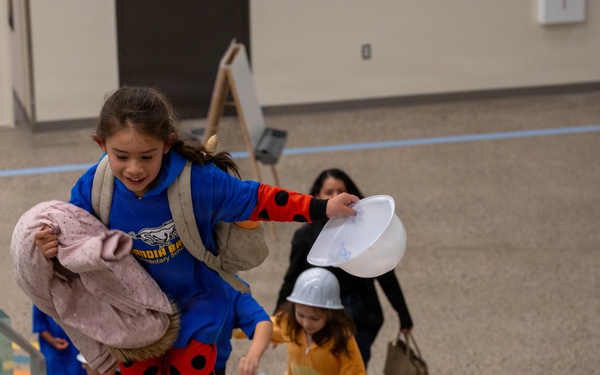 A student climbs the stairs during the Sandia Base Elementary School grand re-opening event.