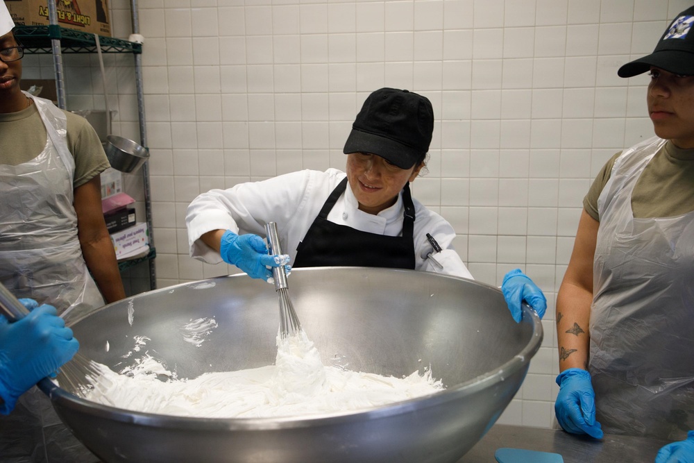 Dogface Soldiers decorate cakes