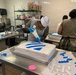Dogface Soldiers decorate cakes