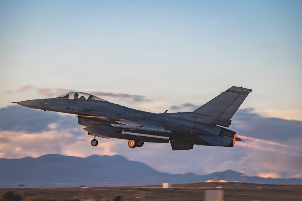 Fighting Falcon streaks over Edwards at sunset