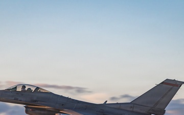 Fighting Falcon streaks over Edwards at sunset