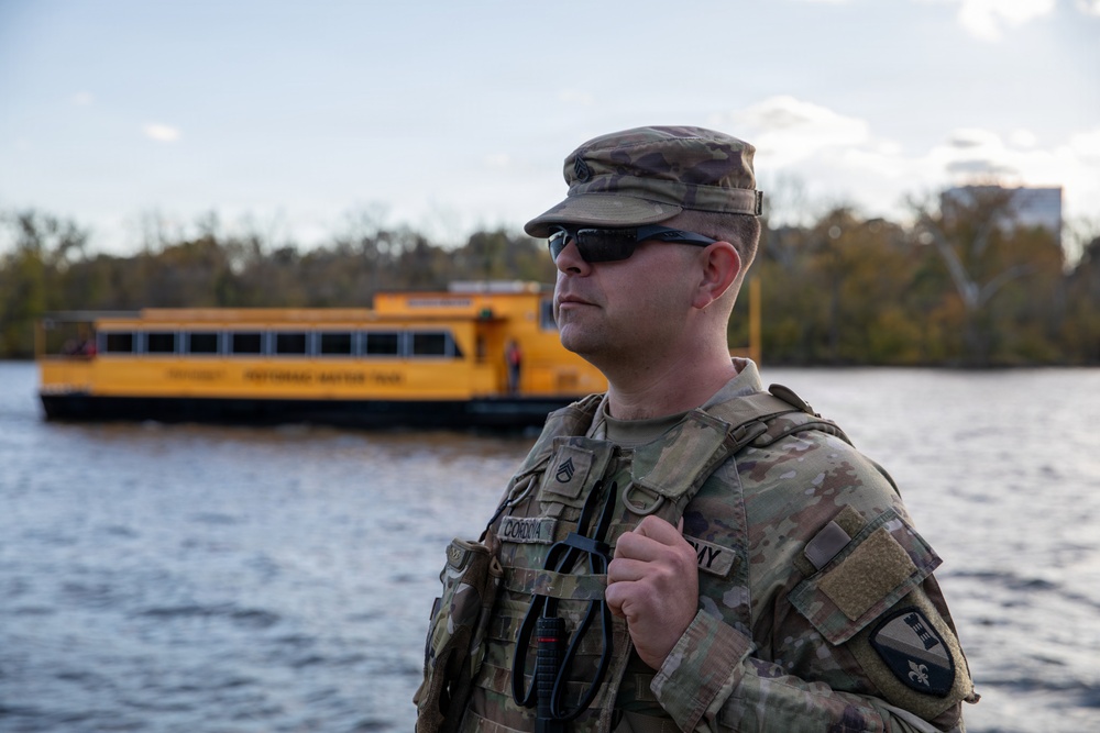 Joint Task Force Magnolia Soldier on patrol during Halloween
