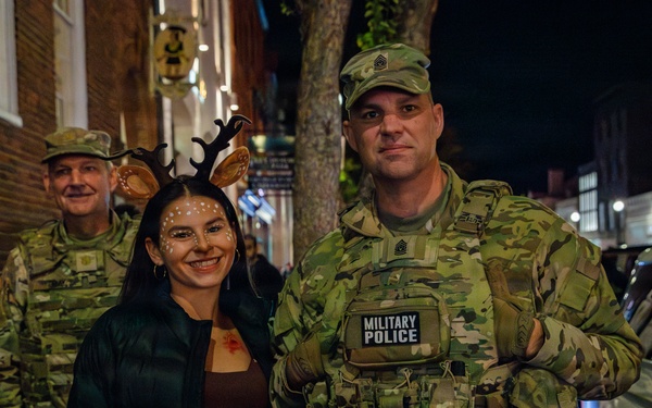 Joint Task Force Magnolia leadership takes pictures with the public on patrol on Halloween