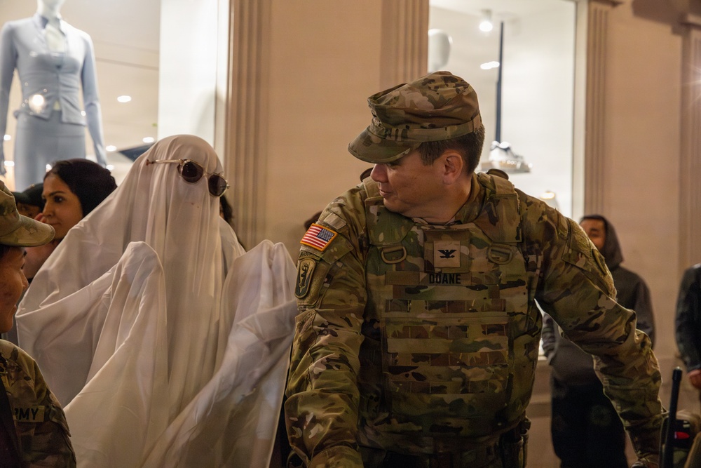 Joint Task Force–District of Columbia commander interacts with a member of the public on Halloween