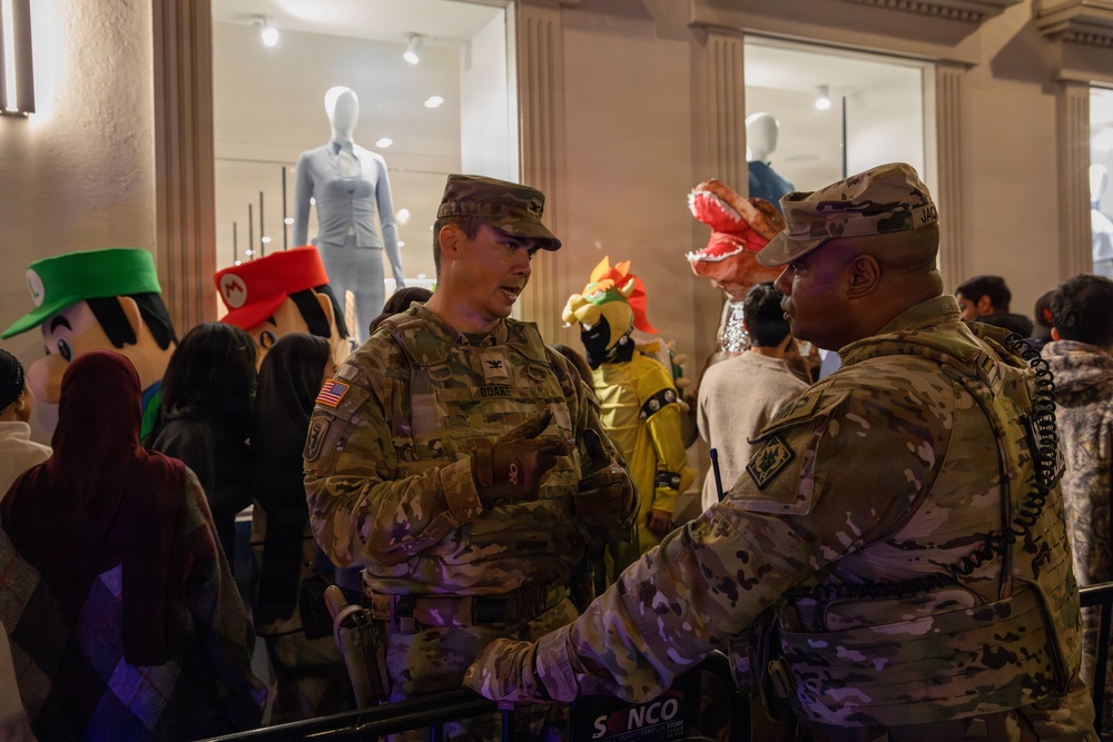 Joint Task Force–District of Columbia commander speaks with Joint Task Force Magnolia commander during Halloween