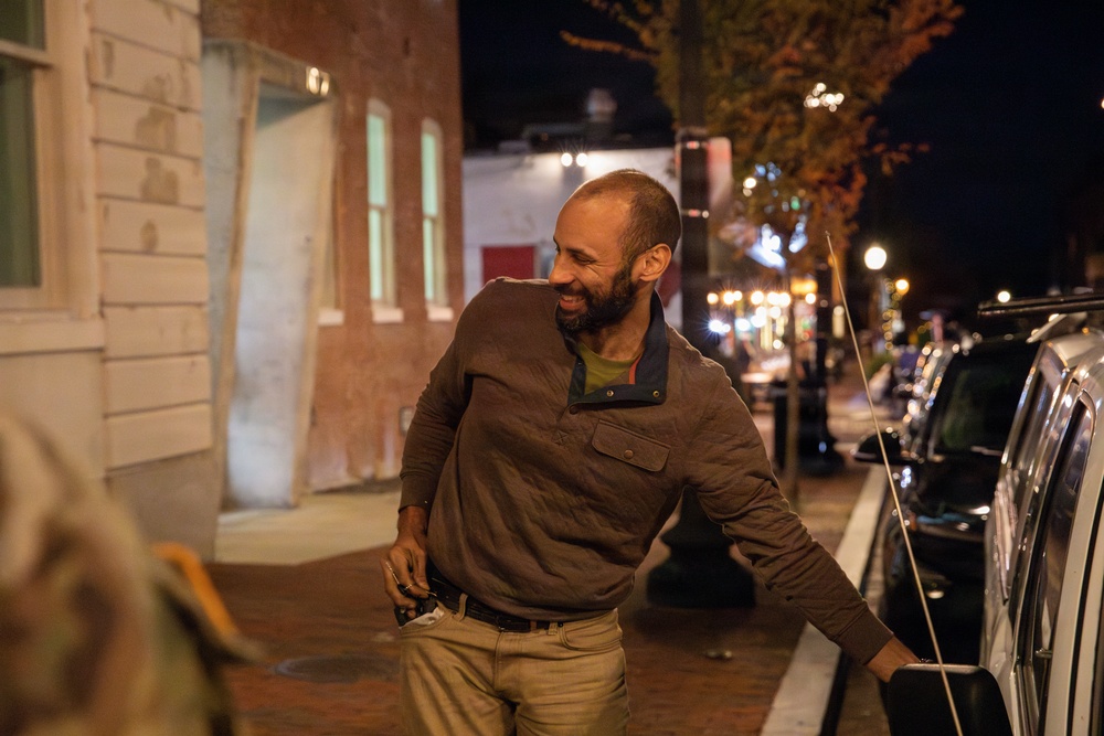 Mississippi Army National Guard Soldiers help change a tire on Halloween