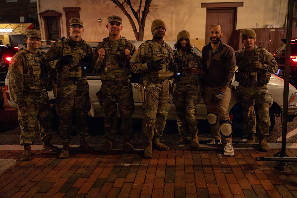 Mississippi Army National Guard Soldiers help change a tire on Halloween