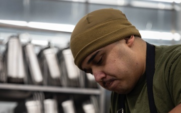 U.S. Marines, prepare Thanksgiving meal for Marines, Sailors while on European deployment