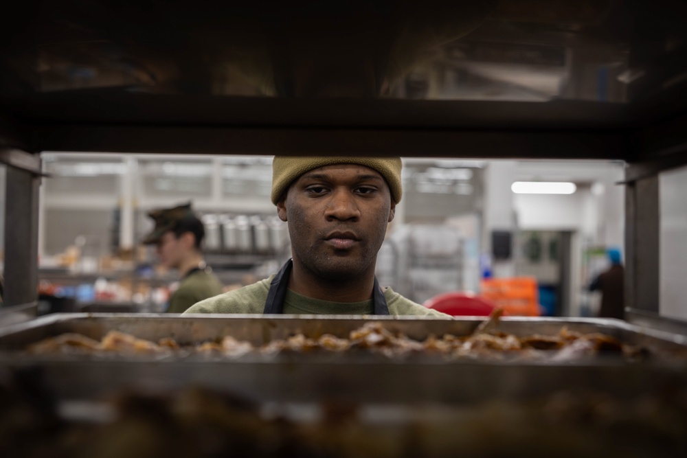 U.S. Marines, prepare Thanksgiving meal for Marines, Sailors while on European deployment