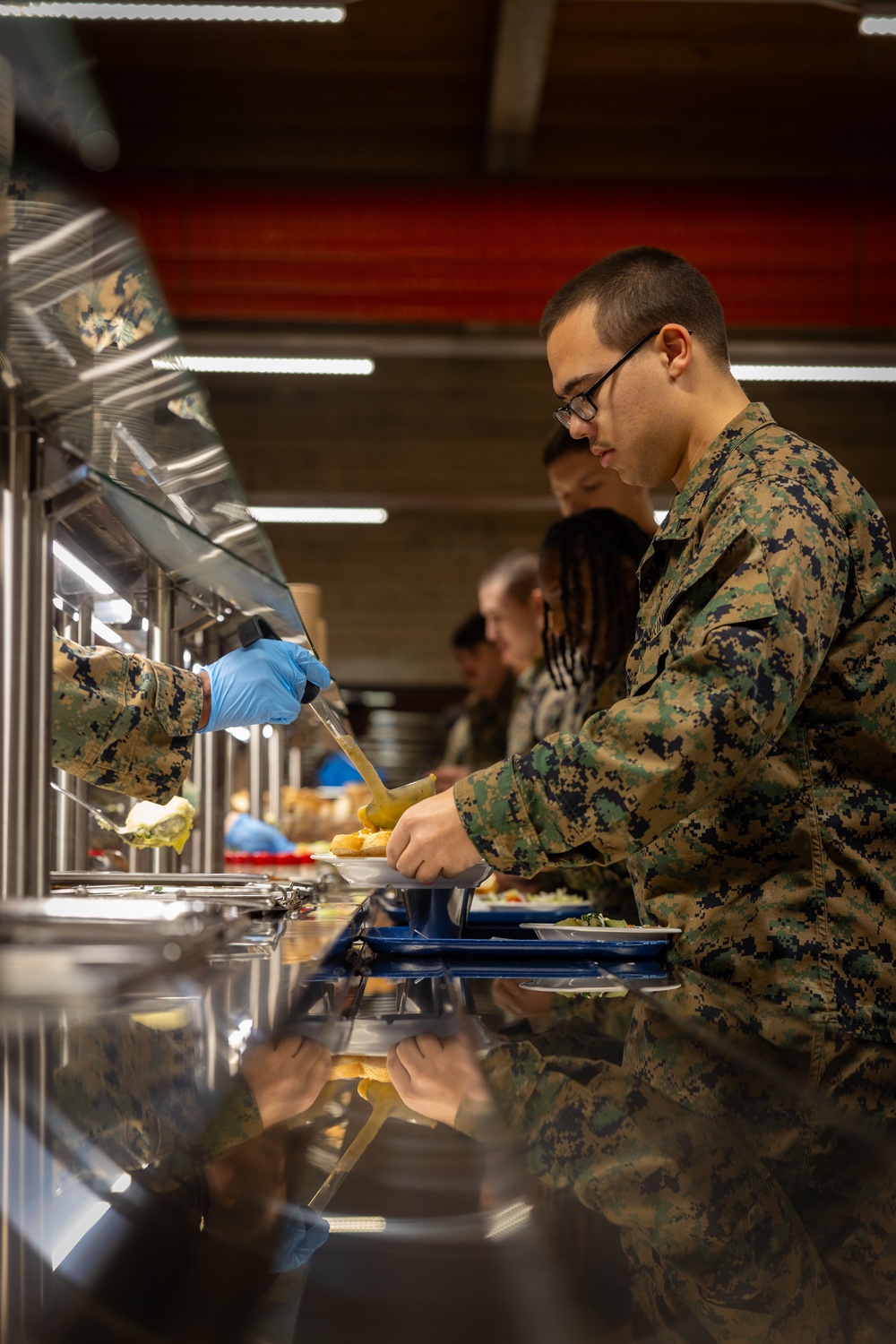 U.S. Marines and Sailors, celebrate a Thanksgiving meal while on European deployment