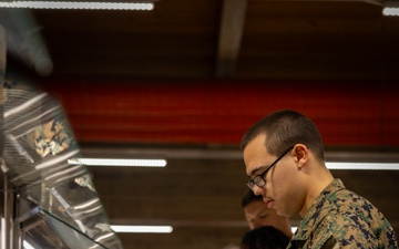 U.S. Marines and Sailors, celebrate a Thanksgiving meal while on European deployment