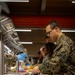 U.S. Marines and Sailors, celebrate a Thanksgiving meal while on European deployment