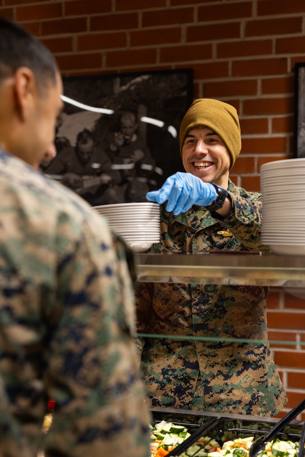 U.S. Marines and Sailors, celebrate a Thanksgiving meal while on European deployment