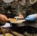 U.S. Marines and Sailors, celebrate a Thanksgiving meal while on European deployment