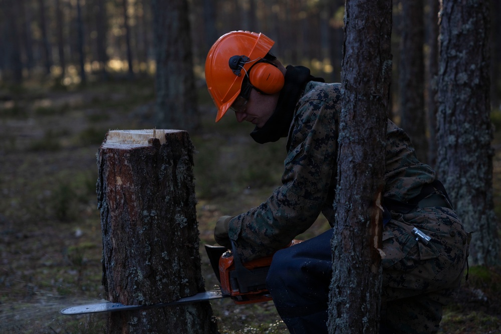 U.S. Marines with MWSS-273 and CLB-6 participate in tree falling operations
