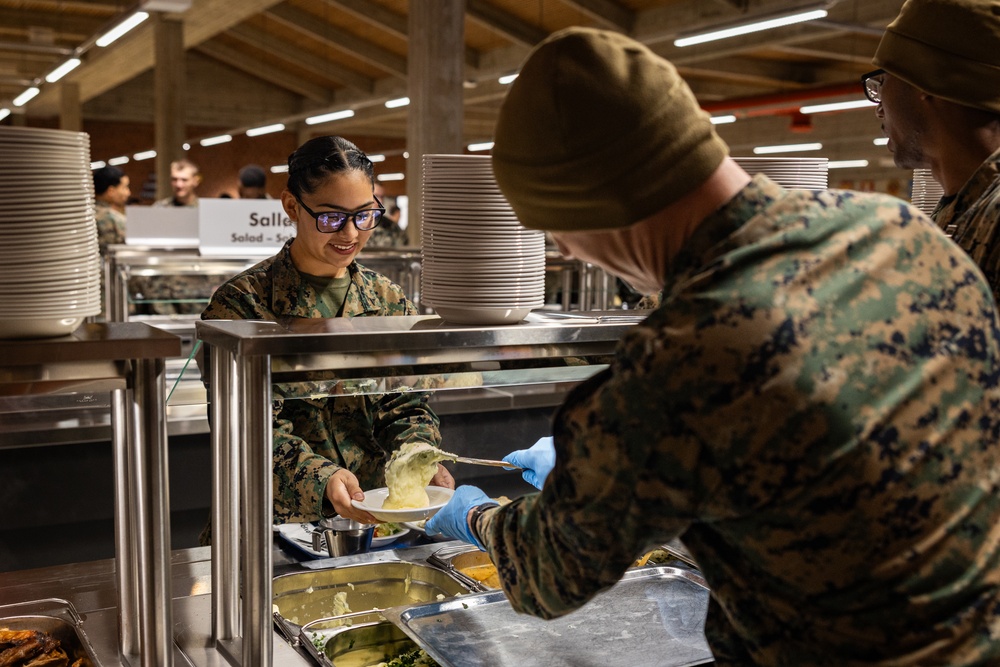 U.S. Marines and Sailors, celebrate a Thanksgiving meal while on European deployment