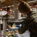 U.S. Marines and Sailors, celebrate a Thanksgiving meal while on European deployment