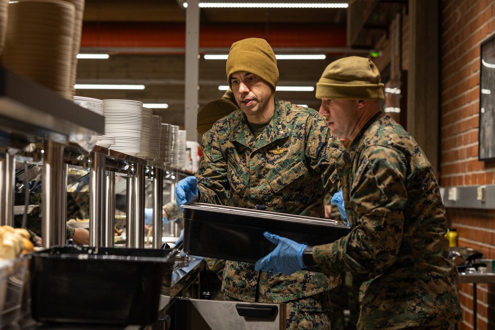 U.S. Marines and Sailors, celebrate a Thanksgiving meal while on European deployment