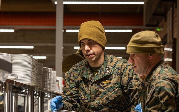 U.S. Marines and Sailors, celebrate a Thanksgiving meal while on European deployment