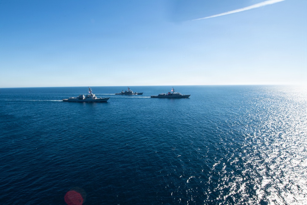 USS Jack H. Lucas (DDG 125) sails alongside Japan Maritime Self-Defense Force