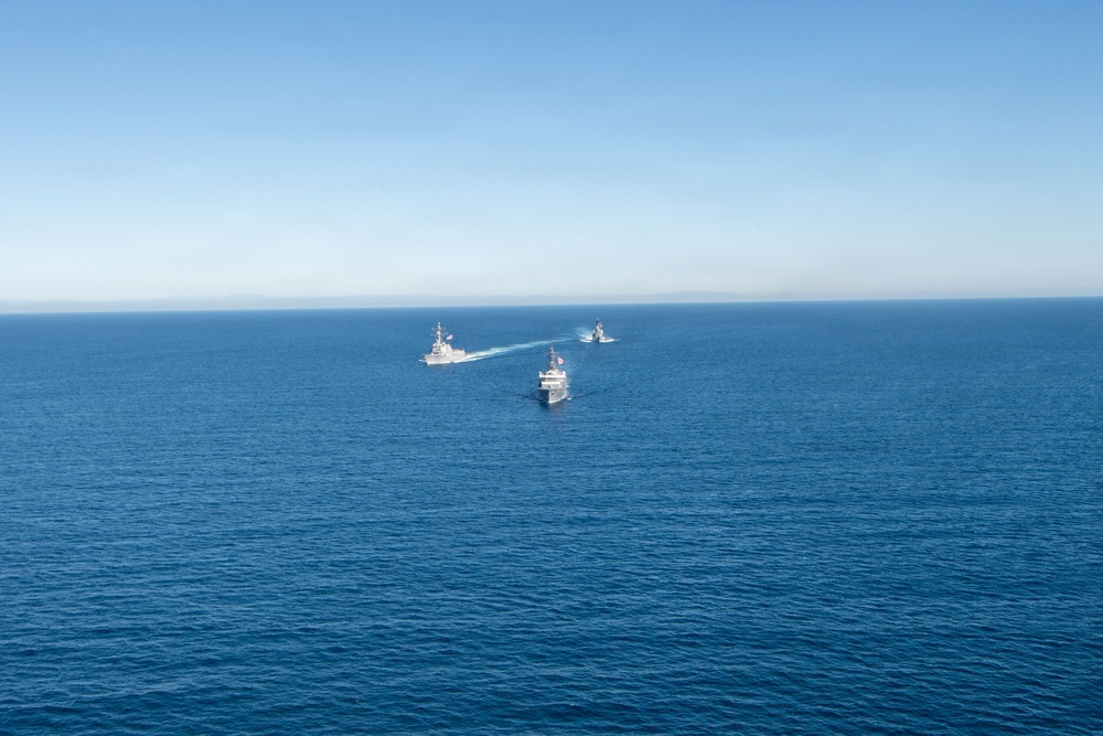 USS Jack H. Lucas (DDG 125) sails alongside Japan Maritime Self-Defense Force