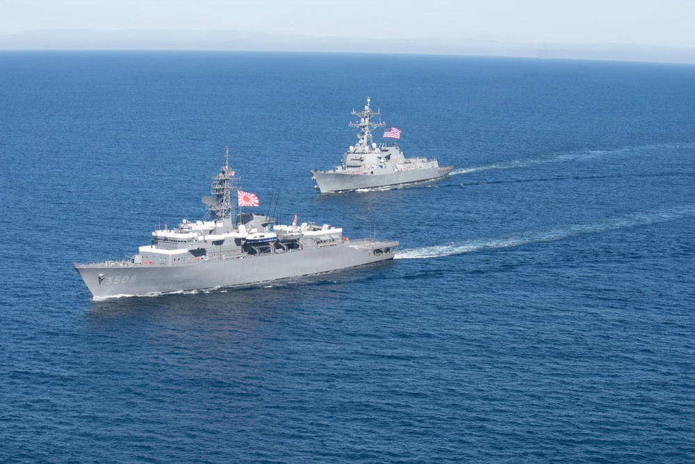 USS Jack H. Lucas (DDG 125) sails alongside Japan Maritime Self-Defense Force