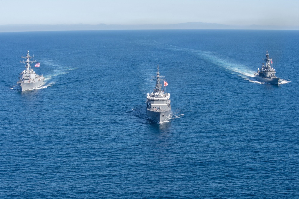 USS Jack H. Lucas (DDG 125) sails alongside Japan Maritime Self-Defense Force