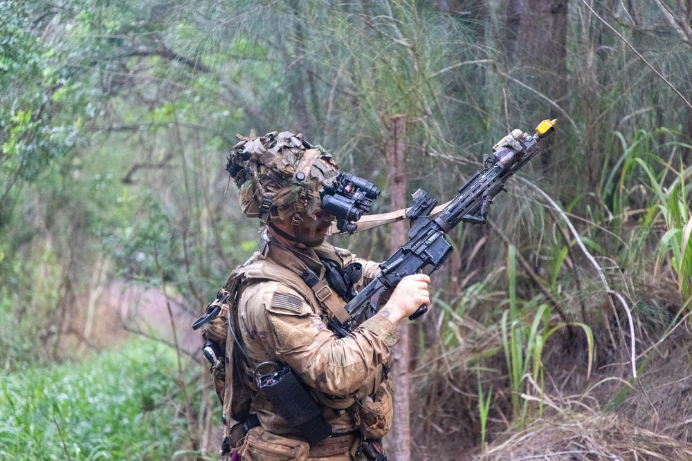 Soldier inspects rifle
