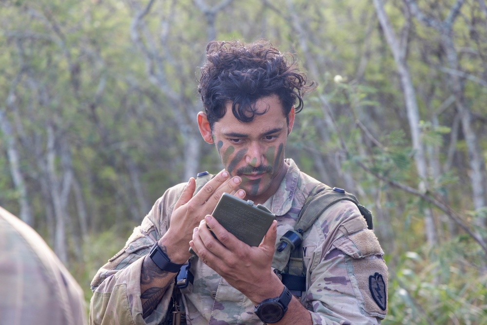 Soldier applies face paint