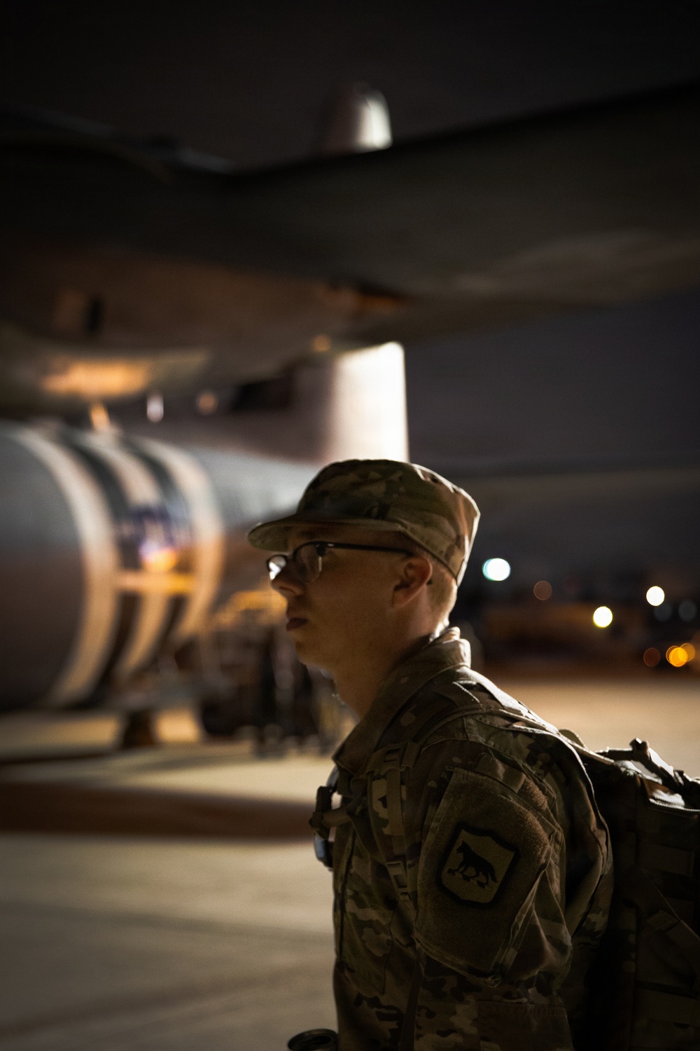 South Dakota Army National Guard soldier Sgt. Bryce Muirhead, waits patiently to board a C-130J Super Hercules