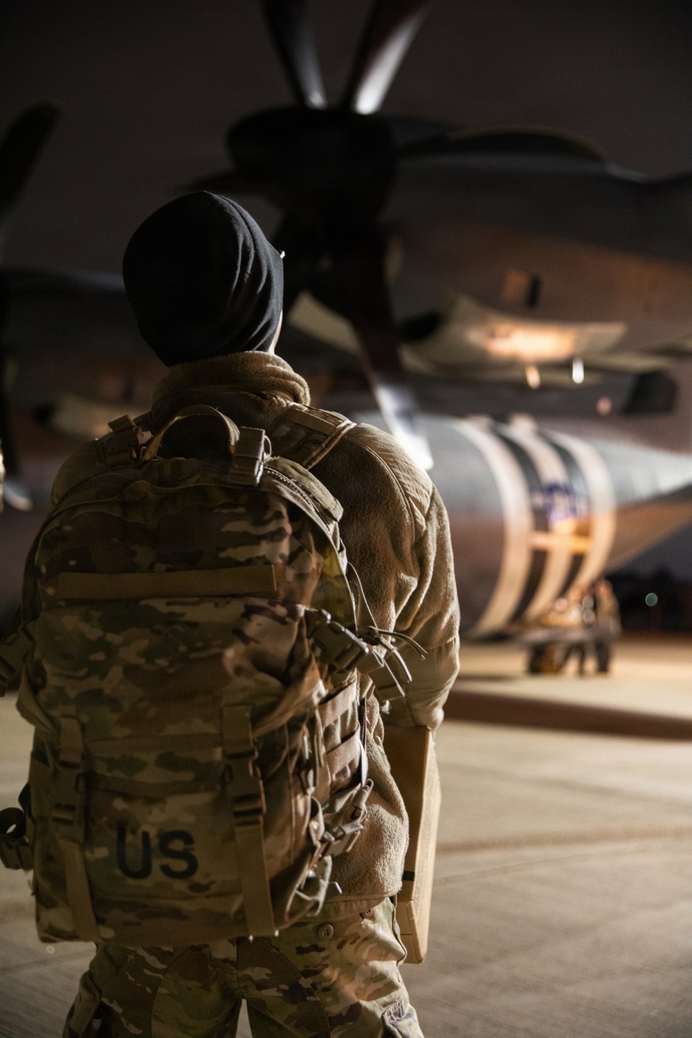 A 147th Army Band, South Dakota Army National Guard soldier looks at the C-130J Super Hercules