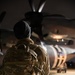 A 147th Army Band, South Dakota Army National Guard soldier looks at the C-130J Super Hercules